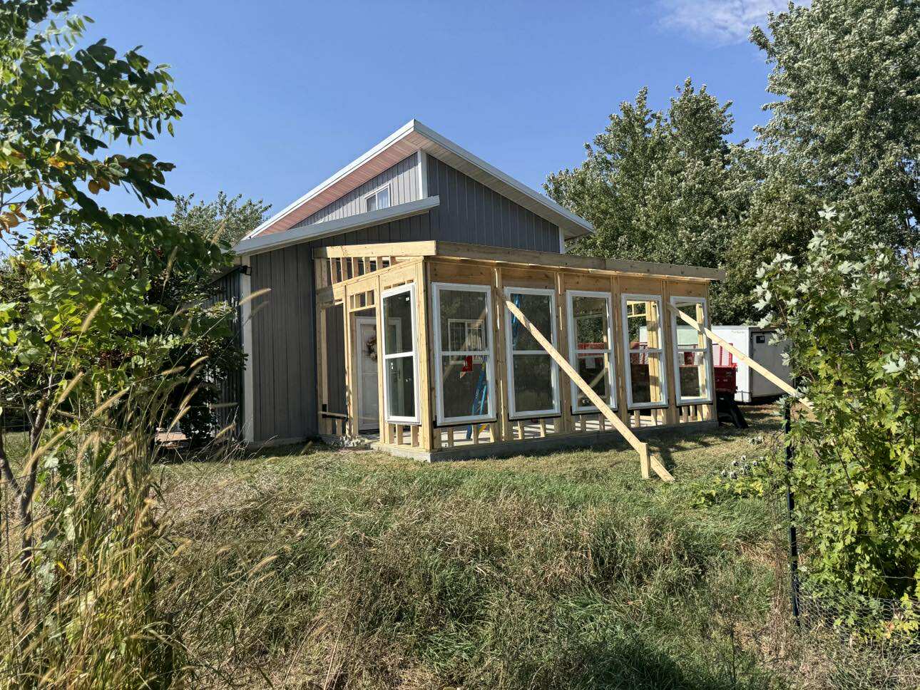Painter rolling a wall in a bright room